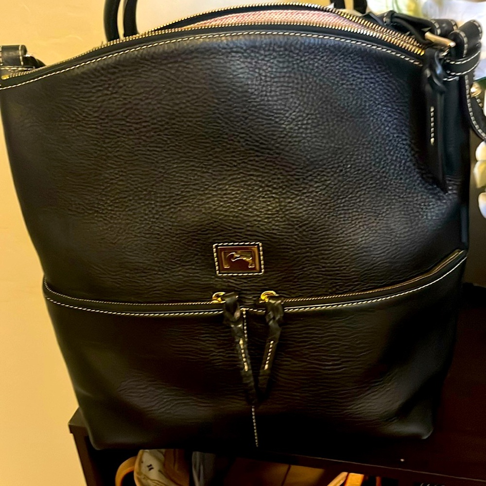 Bag is soft pebble leather, with endless compartments and chic slouchy shape!